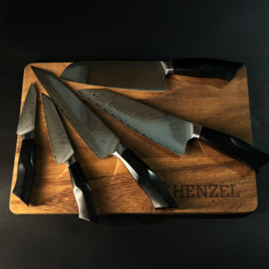 Damascus Steel Knife Set by Henzel - Chef, Santoku, Utility, Paring, and Carving Knives on Wooden Board