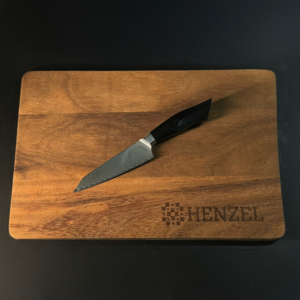 Utility Kitchen Knife on Wooden Cutting Board by Henzel