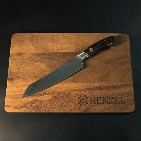 Serrated Bread Knife from Henzel Damascus Steel Set on Cutting Board