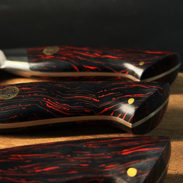 Close-up of Henzel Kitchen Knife Set Handles with Damascus Steel Pattern