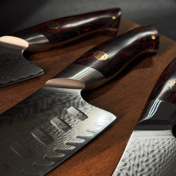 Close-up of Henzel Kitchen Knife Set Red Wood Handles and Damascus Steel Pattern