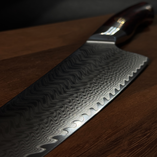 Close-up of Chef Knife with Beautiful Damascus Steel Patterns by Henzel